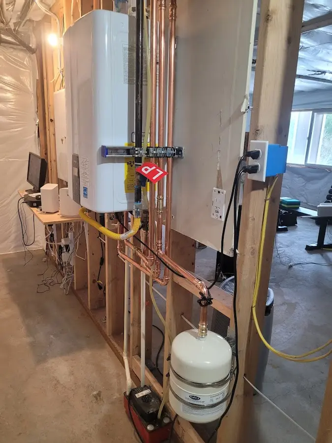 Licensed plumber repairing a kitchen sink in Howell